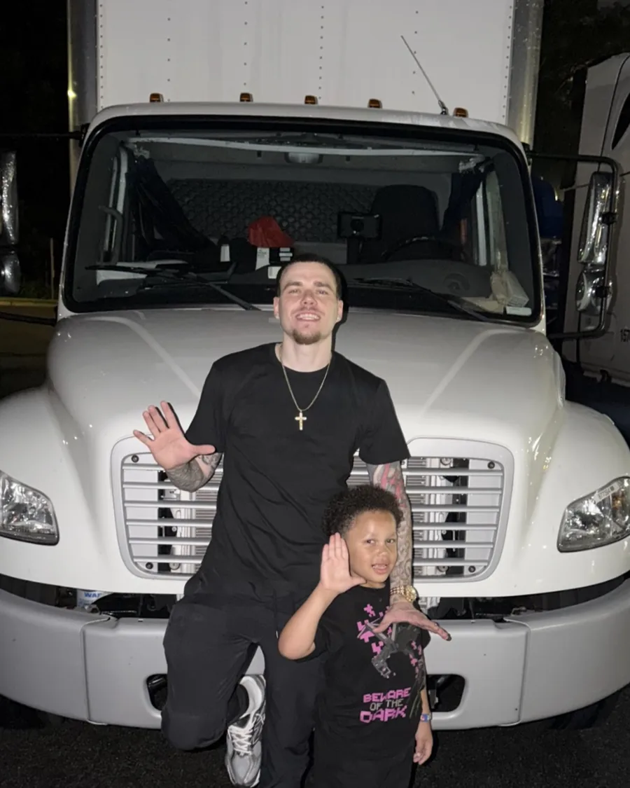 Anthony Schulz standing in front of a Freightliner box truck